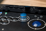 Reflective photo of the arcade spinner, trackball and buttons