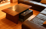 Double7 walnut table with control panel open and large corner sofa