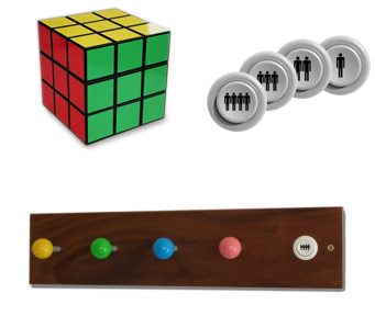 Arcade coat hooks, button coasters and Rubik's cube seat on white background